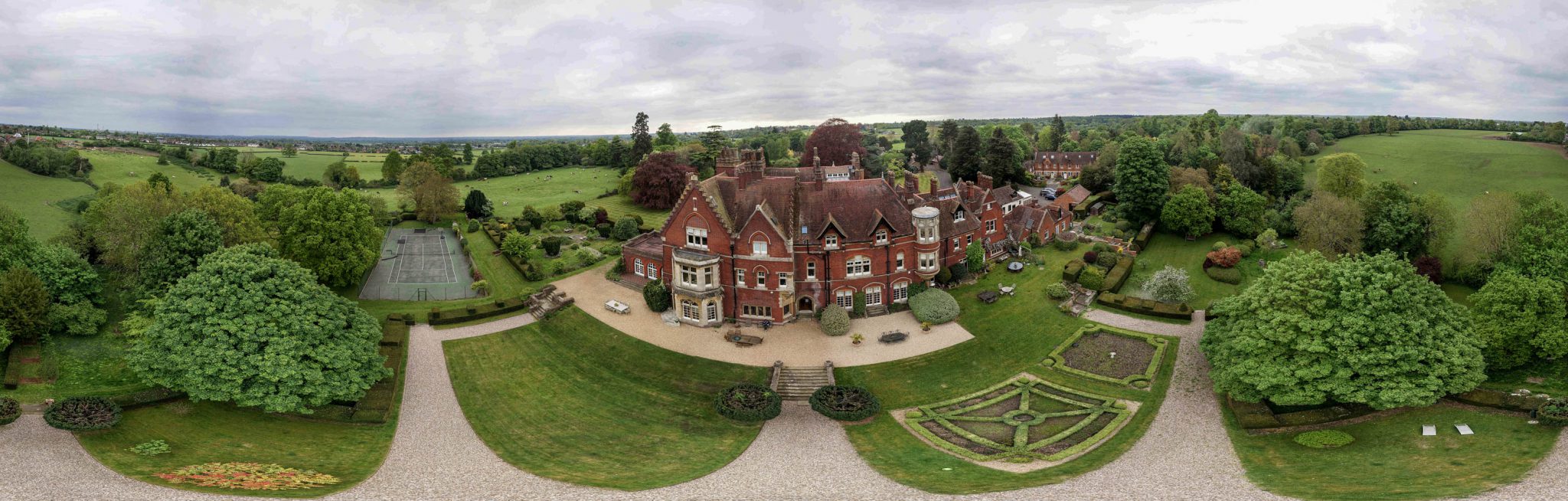 Panoramic photograph of a large English country house, taken from a drone during a 3D environment scan capture.