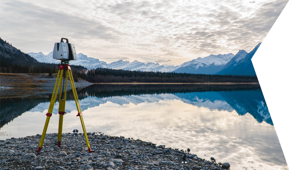 Clear Angle Leica P40 Lidar Scanner next to a lake with snowy mountains in the background.