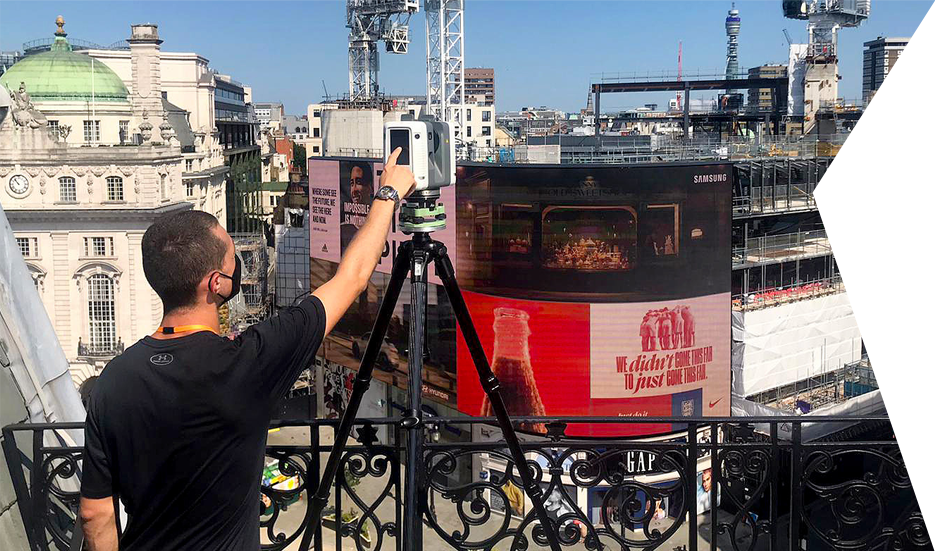 Clear Angle Studios crew member Lidar Scanning in Piccadilly Circus, London with a Leica RTC 360 